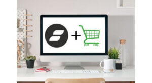 Dsk with computer screen showing Showit plus Shopify shopping cart green icon